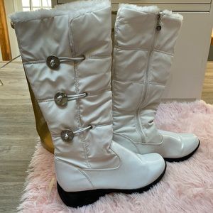 Faux fur lined white boots.